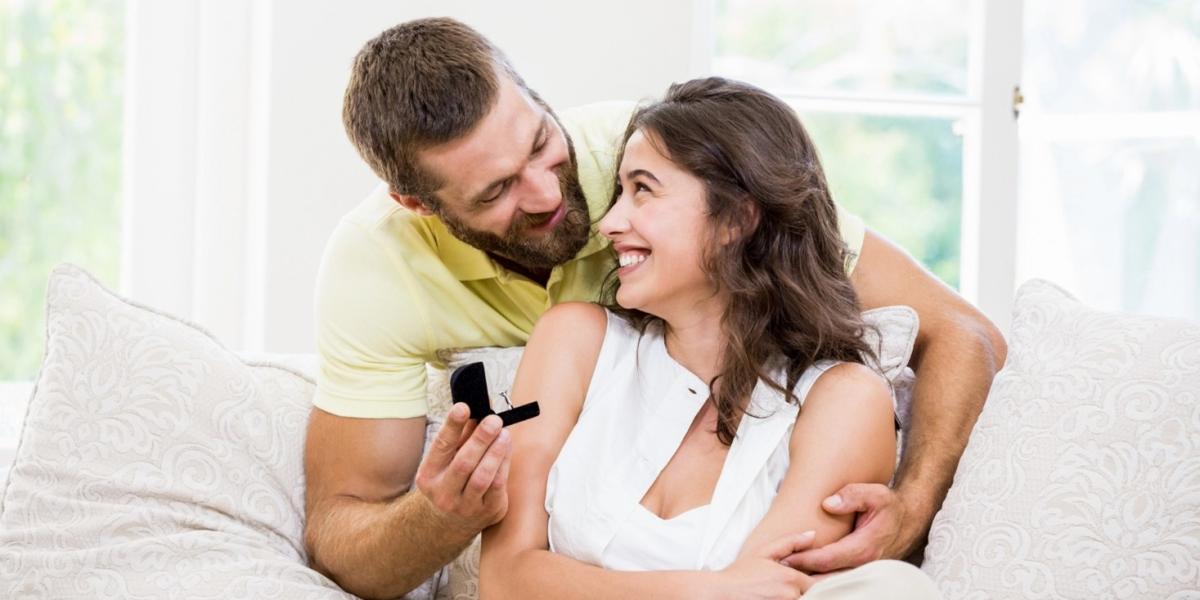 A happy couple celebrating their anniversary with an anniversary ring