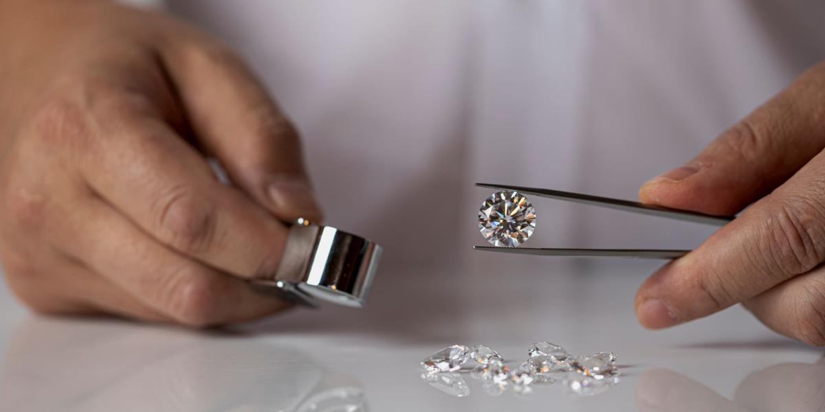 Picture of an expert grading diamonds