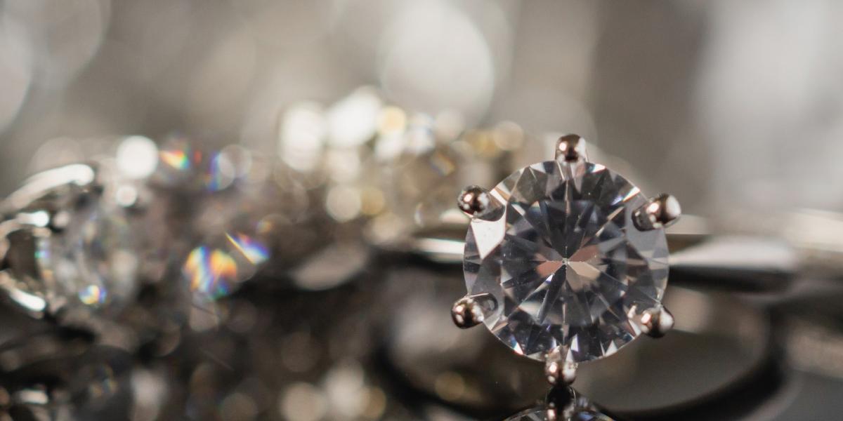 Luxury jewellery diamond rings with reflection on black background