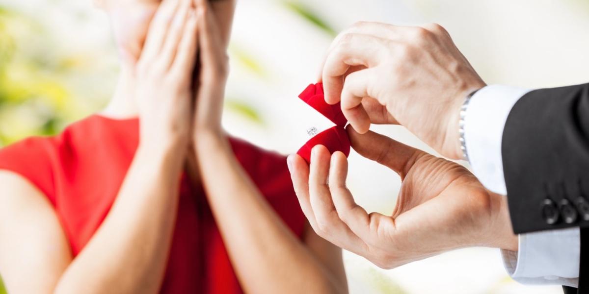 Couple with a ruby wedding ring and gift box