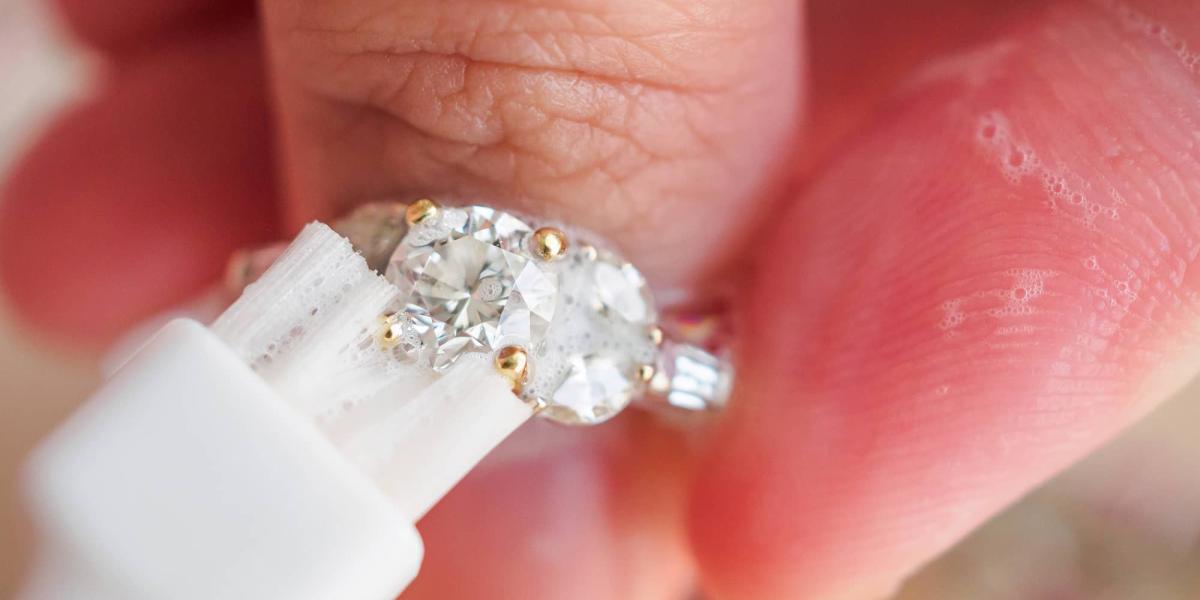 Picture of person cleaning a diamond ring