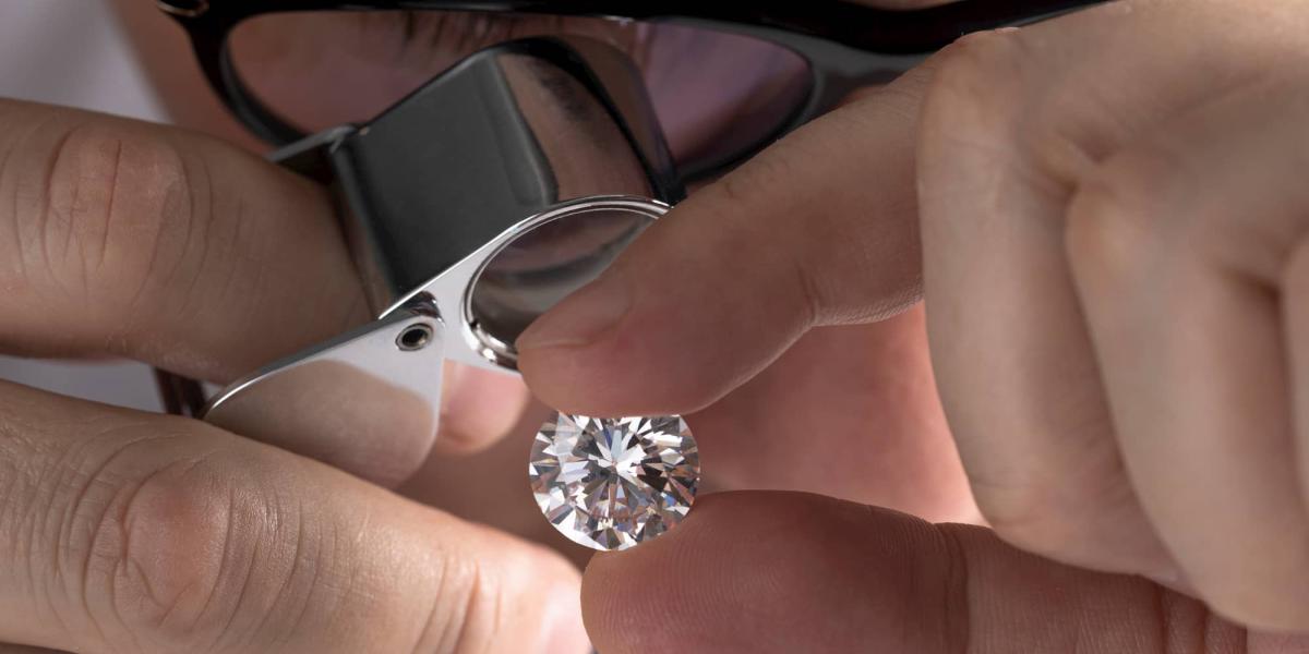 Picture of a person inspecting a diamond